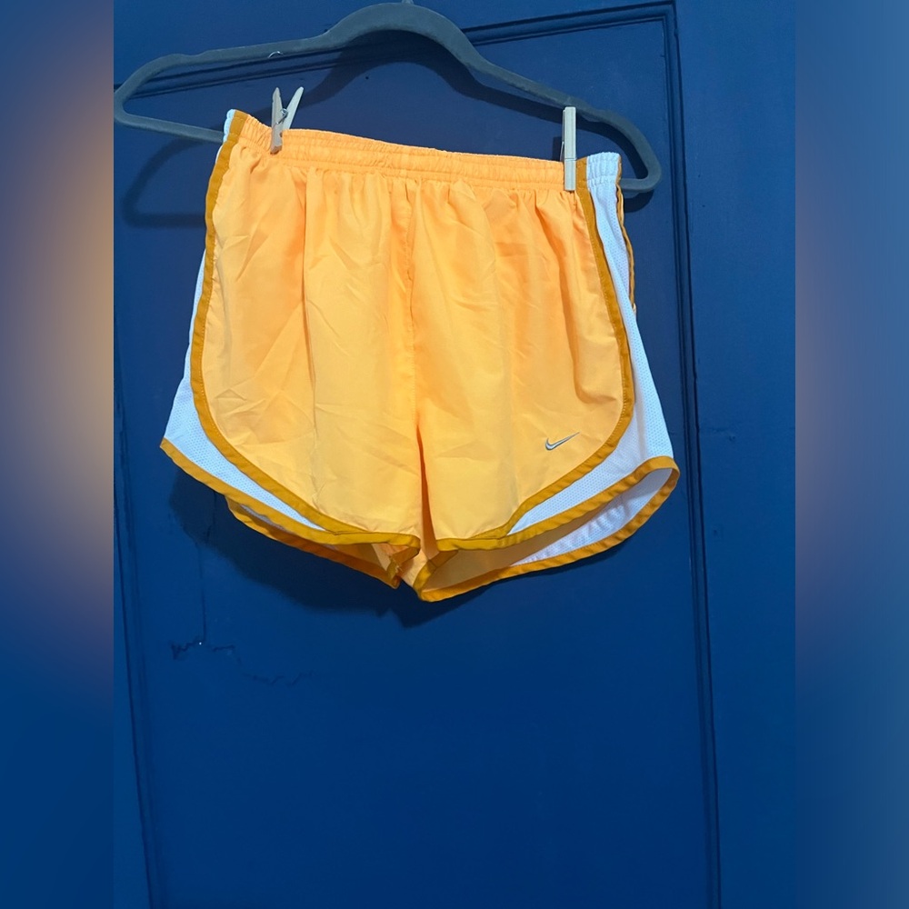 Orange Nike dri-fit shorts. Has an underwear inside and barely wore.